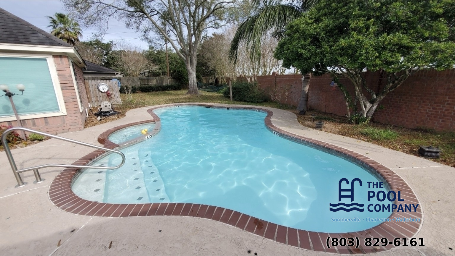 Clean pool with brick surround after professional cleaning service